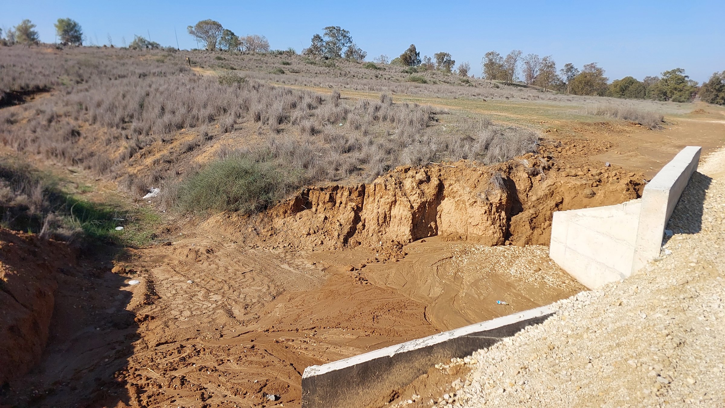 Road embankment crossing an ephemeral stream in the western Negev